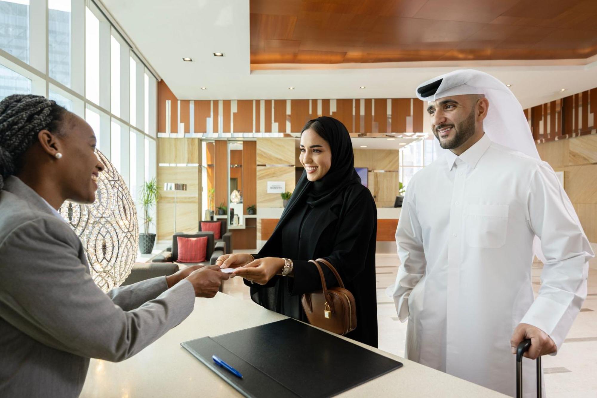 Delta Hotels By Marriott City Center Доха Экстерьер фото A hotel receptionist welcomes guests
